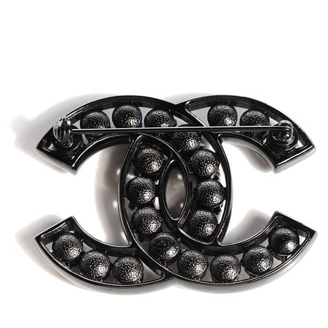 chanel brooch black and clear crystals cross